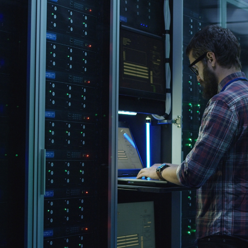 A man using a supercomputer to review and analyze large data sets