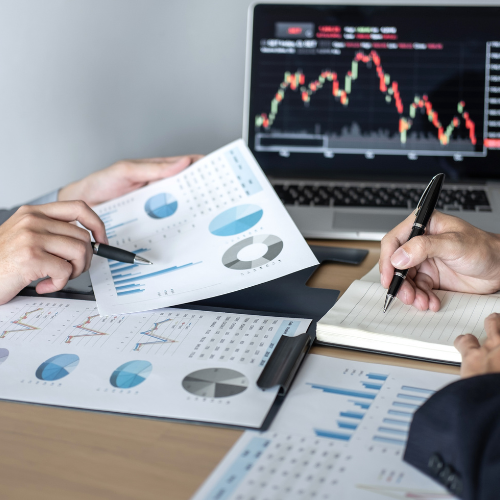 Individuals reviewing graphs and financial projections