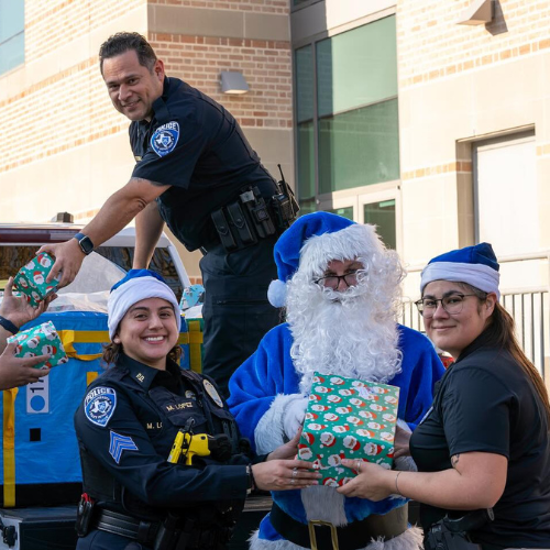 RUPD distributing gifts for the Blue Santa Toy Drive