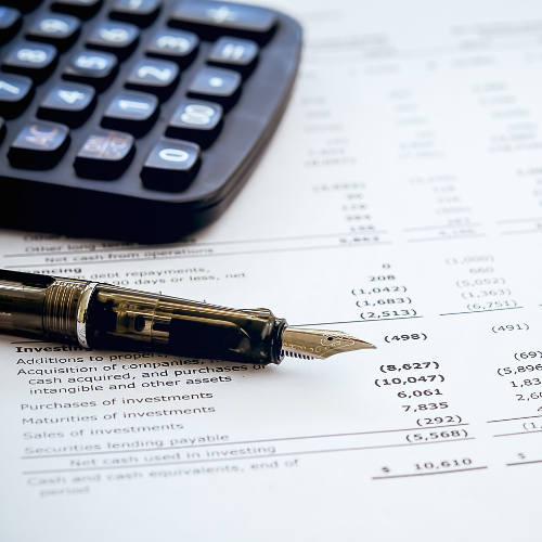 Budget sheet with a fountain pen and calculator