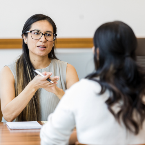a manager giving feedback to her employee