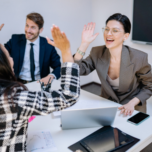 Two colleagues high-fiving