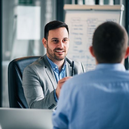 Manager speaking to his employee