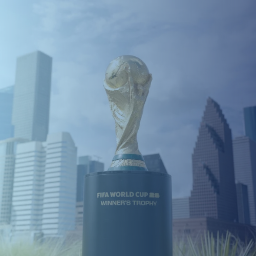 FIFA world cup trophy in front of Houston skyline