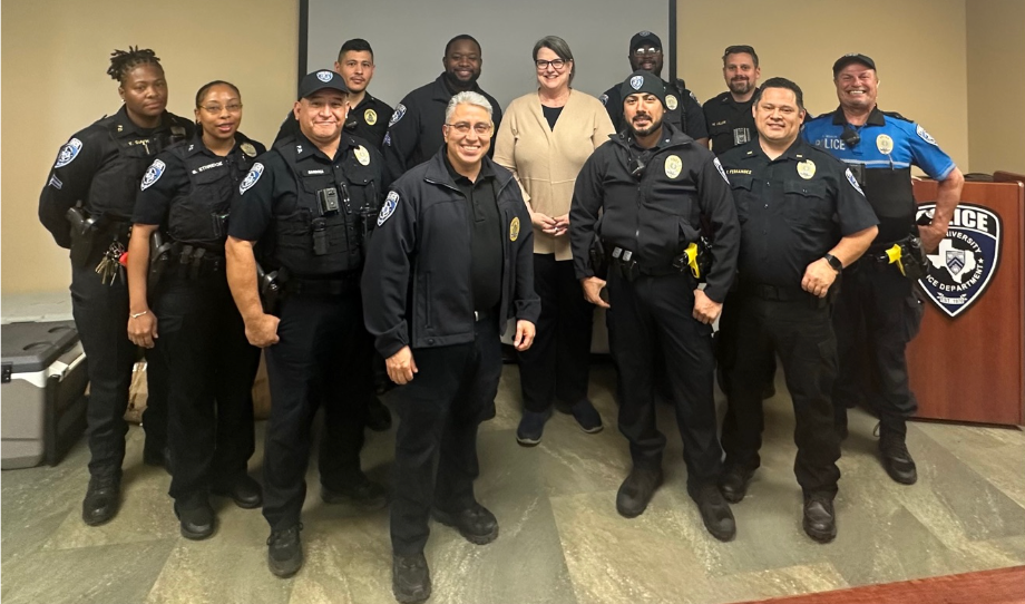 Kelly Fox with RUPD Officers being recognized with a spotlight award.