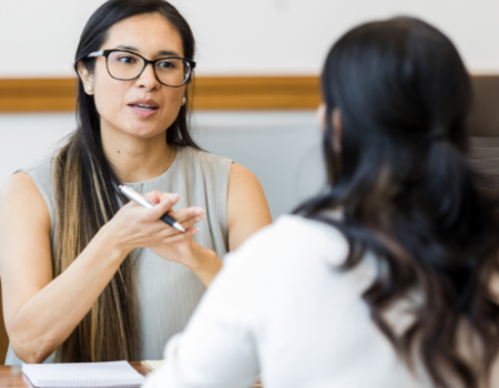 a manager giving feedback to her employee