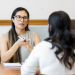 a manager giving feedback to her employee